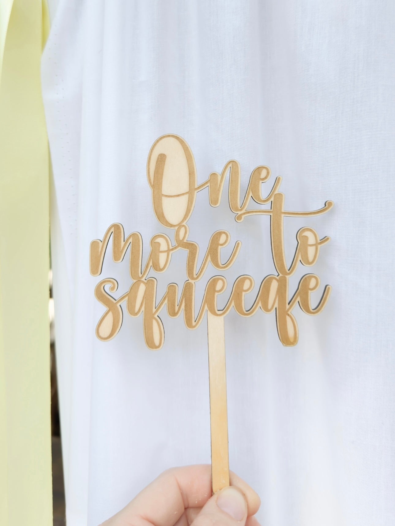 One More To Squeeze Cake Topper