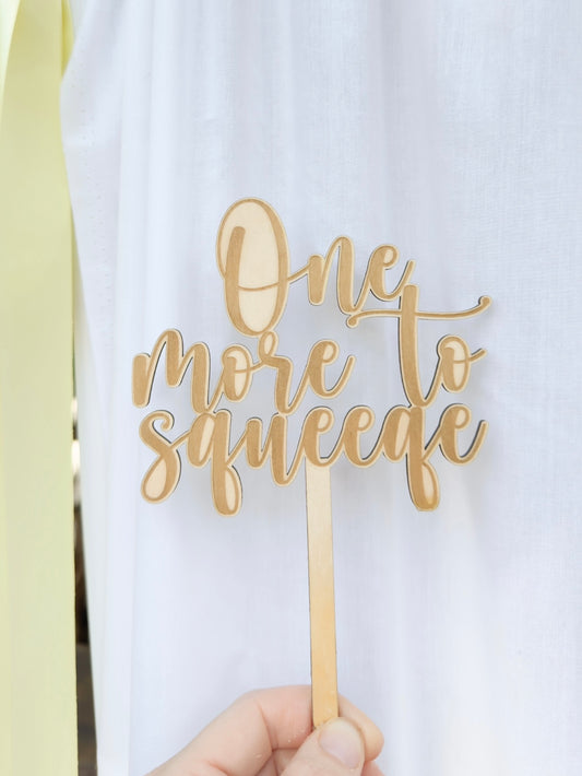 One More To Squeeze Cake Topper